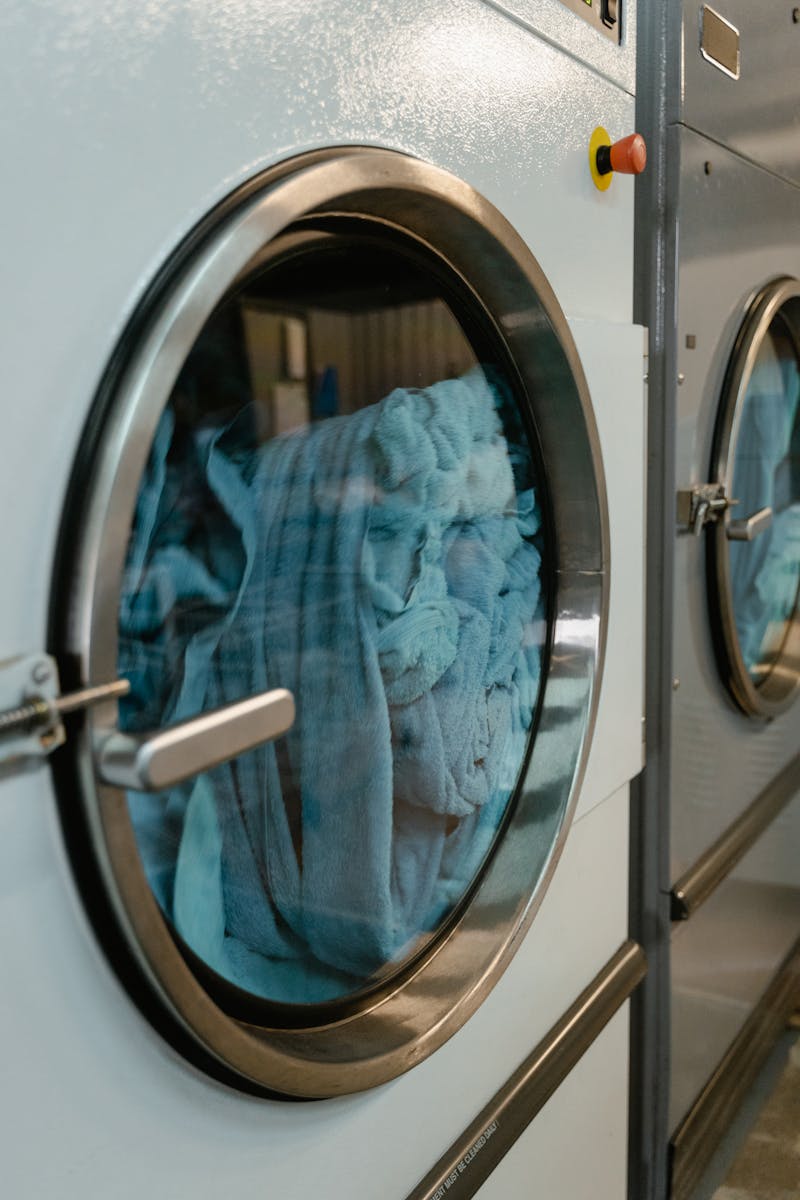 Blue Towels in a Front Load Washing Machine